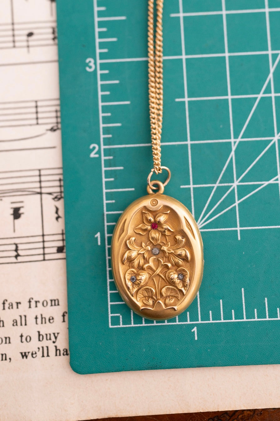 Oval Repousse Floral Locket with Red & Clear Accents